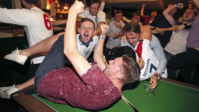 England supporters celebrate Harry Kane's winning goal.
