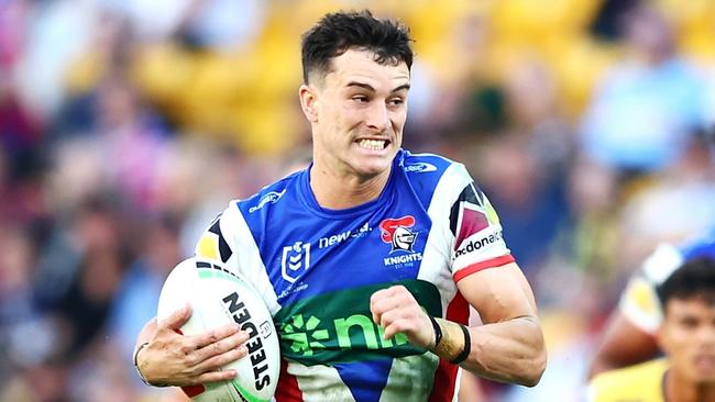 BRISBANE, AUSTRALIA - MAY 18: David Armstrong of the Knights breaks a way to score a try during the round 11 NRL match between Gold Coast Titans and Newcastle Knights at Suncorp Stadium, on May 18, 2024, in Brisbane, Australia. (Photo by Chris Hyde/Chris Hyde)