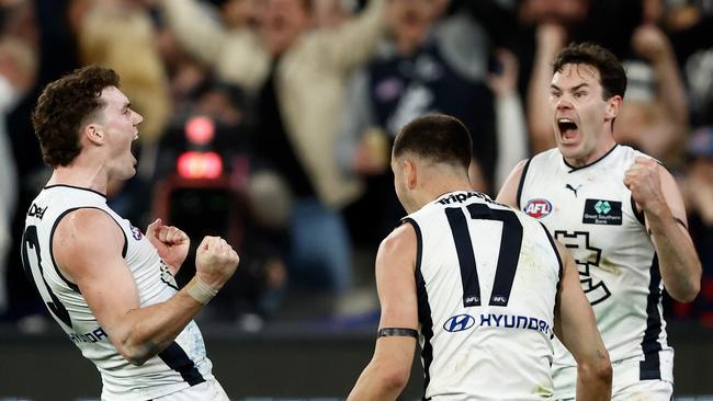 (L-R) Blake Acres, Brodie Kemp and Mitch McGovern explode. Picture: Michael Willson/AFL Photos via Getty Images