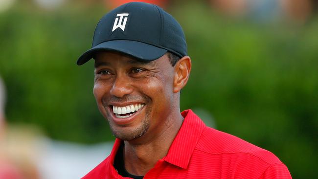 Tiger Woods reacts during the trophy presentation ceremony after winning the Tour Championship at East Lake Golf Club on Sunday. Picture: Getty Images