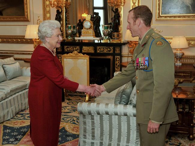 Queen Elizabeth greets Australian trooper Mark Donaldson VC during a private audience at Windsor Castle on November 10, 2009.