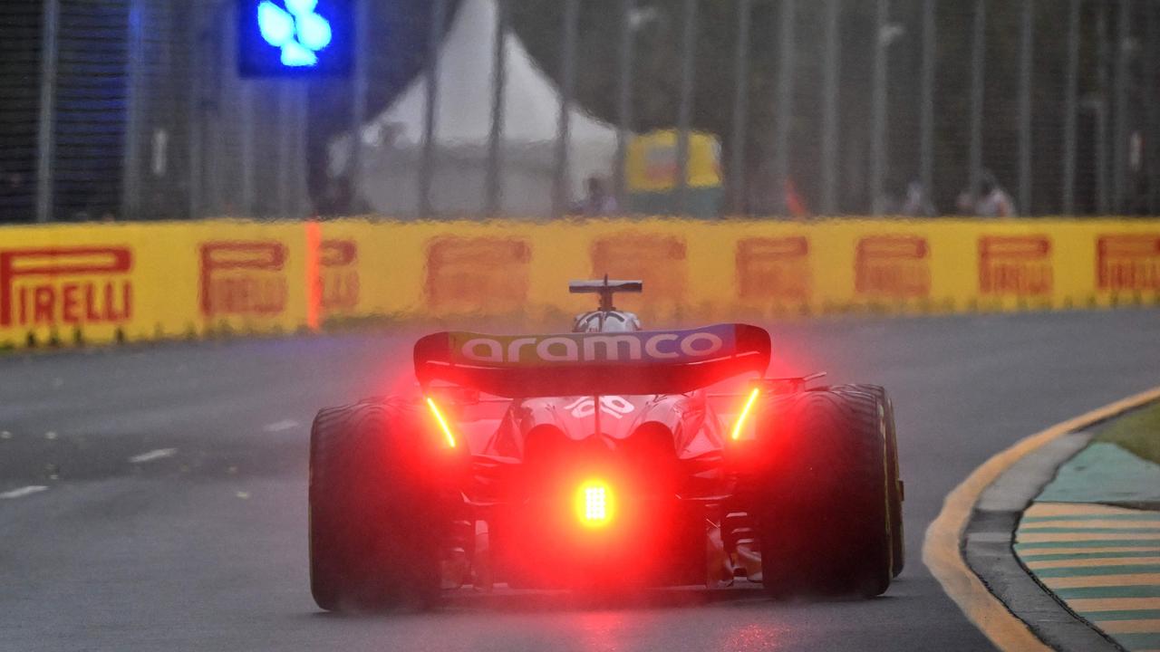 Aston Martin's Spanish driver Fernando Alonso mastered the greasy conditions.