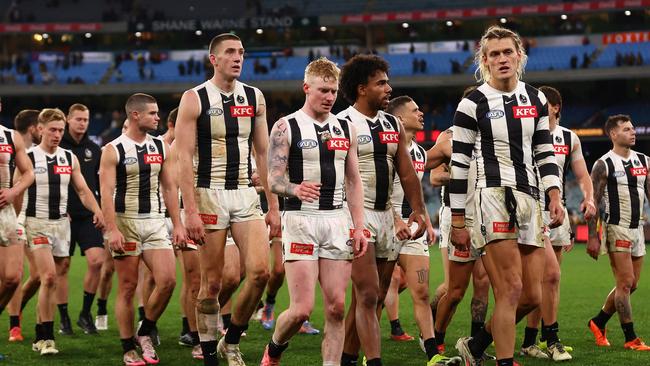 The dejected Magpies after losing to Hawthorn. Picture: Graham Denholm/AFL Photos/via Getty Images