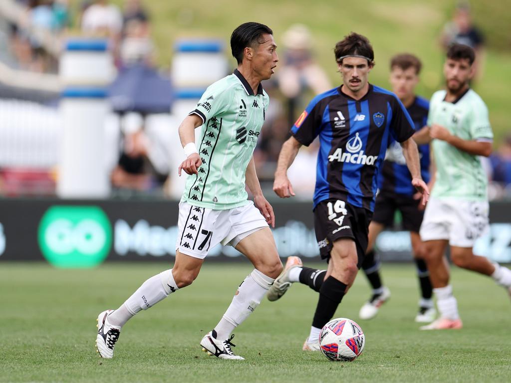 Riku Danzaki of Western United (L) with Liam Gillion of Auckland FC. Picture: Fiona Goodall/Getty Images