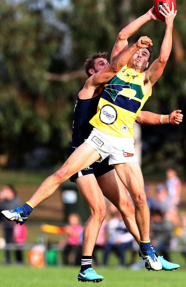 Eagle Jack Gaffney takes a mark under pressure from South's Tyson Brown in May. Picture: Tait Schmaal