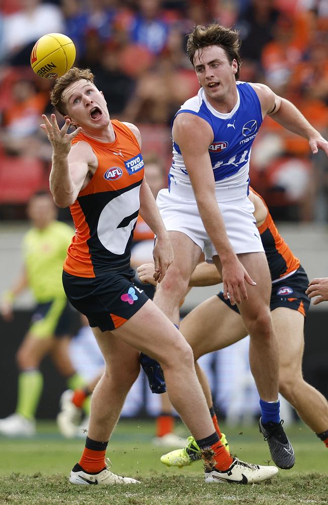 Giants star Tom Green wins the ball in front of young Kangaroo George Wardlaw. Picture: Phil Hillyard