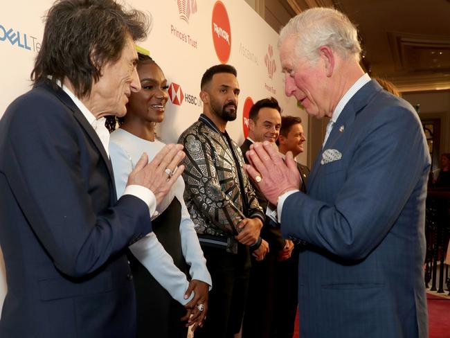 Prince Charles, Prince of Wales uses a Namaste gesture to greet Rolling Stone Ronnie Wood as he attends the Prince's Trust And TK Maxx &amp; Homesense Awards at London Palladium. Picture: Getty