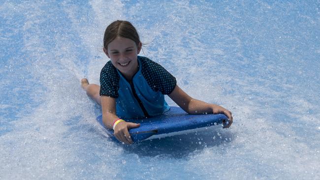 Molly captures a wave on the FlowRider at MSAC.