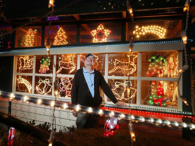 Malcolm Pearce, 74, with his massive Christmas lights display in Risdon Vale.