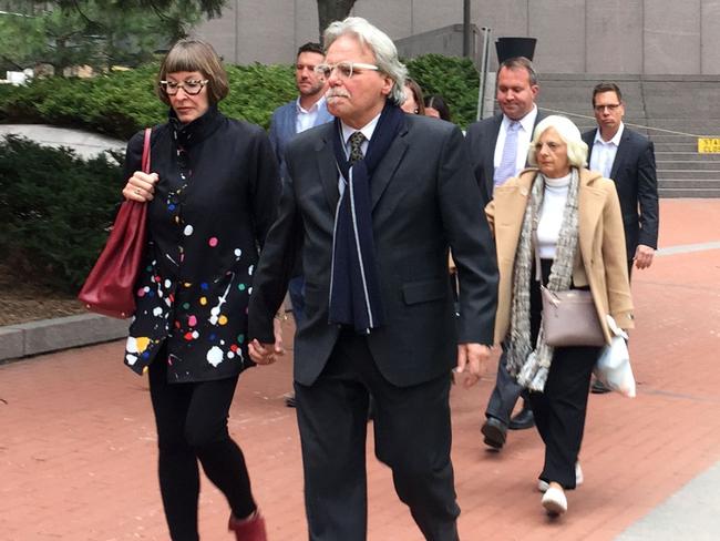 John Ruszczyk, Justine’s father, centre, with his wife Maryan Heffernan. Picture: AFP 