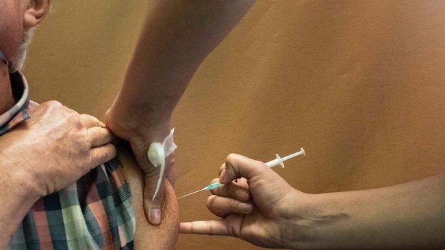 The Pfizer vaccine will be available at Mackay Base Hospital from today. Picture: RODGER BOSCH / AFP