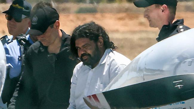 Terence Kelly being taken to prison in Perth from Carnarvon Airport in the days following his arrest in November 2021. Picture: Colin Murty