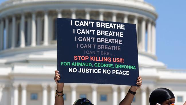 Signs displaying George Floyd’s last words before he died. The same words were said by Eric Garner, a black man killed by police in 2014. (Photo by Jose Luis Magana / AFP)