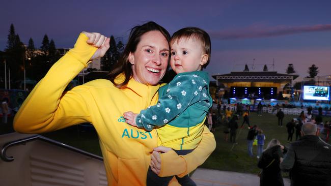 Former Olympic Pole Vaulter Alanah Boyd (now Quade) with 15-month-old Charlotte at the Olympic Live site at Kings Beach. Picture: Lachie Millard