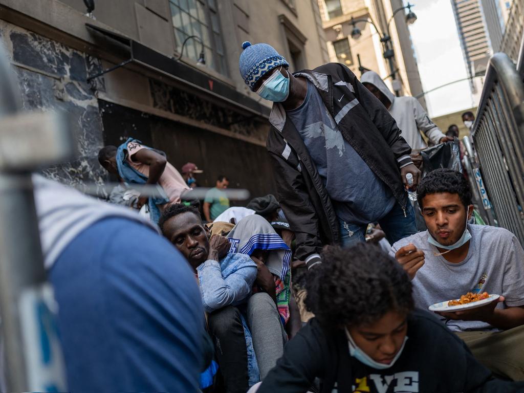 Dozens of recently arrived migrants to New York City camp outside of the Roosevelt Hotel, which has been made into a reception centre (Photo by SPENCER PLATT / GETTY IMAGES NORTH AMERICA / Getty Images via AFP)