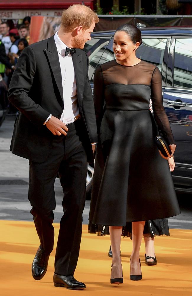 Harry and Meghan arrive on the yellow carpet. Picture: Gareth Cattermole/Getty Images for Disney