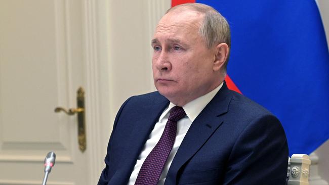 President Vladimir Putin watches training launches of ballistic missiles from the situational centre at the Russian defence ministry in Moscow on Saturday. Picture: AFP