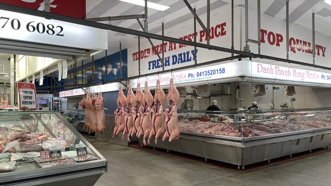 Inside the Preston market hall at 5am as vendors prepare for a busy day of serving customers. Picture: Olivia Condous.