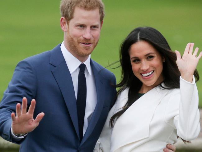 (FILES) In this file photo taken on November 27, 2017 Britain's Prince Harry and  US actress Meghan Markle pose for a photograph in the Sunken Garden at Kensington Palace in west London following the announcement of their engagement. - He may be the Queen's grandson, but she is American cultural royalty: Oprah Winfrey, whose upcoming bombshell interview with Prince Harry and Meghan Markle is dominating headlines, is a billionaire TV phenomenon renowned for coaxing secrets and tears from countless celebrities. From Michael Jackson and Tom Cruise to Lance Armstrong and the Duchess of York, Winfrey is responsible for some of America's most memorable sit-down interviews over the last three decades. Harry and Meghan are the latest to open up when a tell-all interview with the talk show queen is aired by CBS on March 7, 2021. (Photo by Daniel LEAL-OLIVAS / AFP)