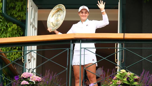 Ash Barty of Australia celebrates with the Venus Rosewater Dish trophy at the All England Lawn Tennis and Croquet Club in London. Picture: Getty Images