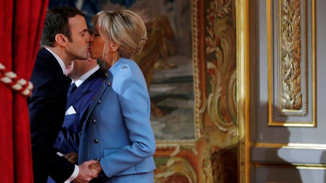 French President Emmanuel Macron kisses his wife Brigitte after taking office in May 2017. Picture: Reuters