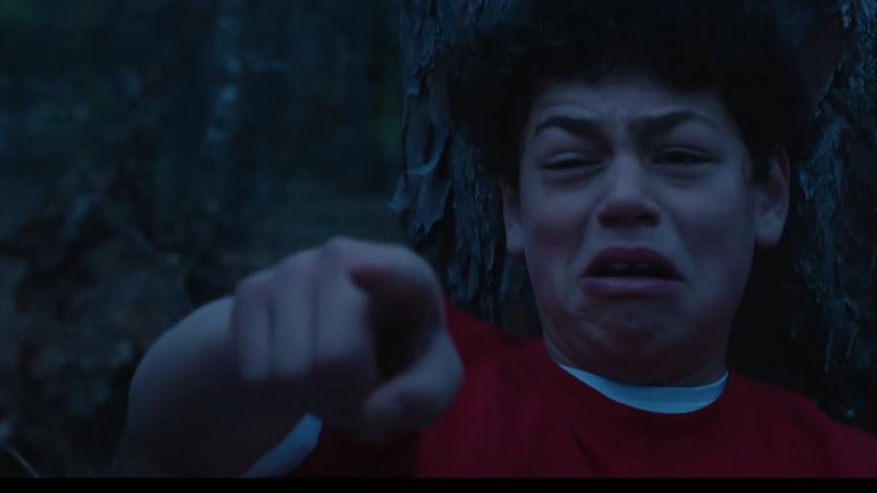 A boy can be seen screaming about a monster.