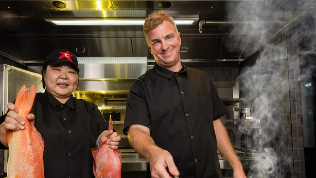 Darling Group executive chef Ashley Hicks with head chef Jun Sun inside their new South Yarra Japanese restaurant, Token. Picture: Jason Edwards