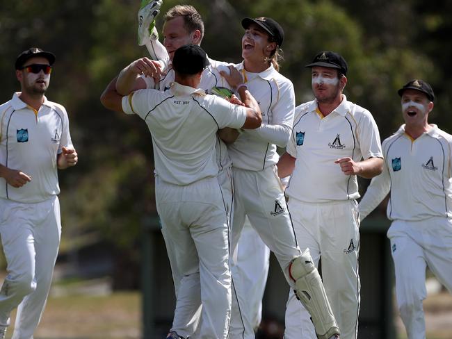 Heidelberg celebrates a Jack Ridewood wicket. Picture: Mark Dadswell