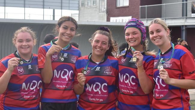 Hannah Dedauntan, Ana Malupo, Courtney Reynolds, Xanthe Topping, and Zoe Aitken celebrating Coastal Neurs' triumph at the Mackay Indigenous Rugby League Carnival. Picture: Mitch Bourke