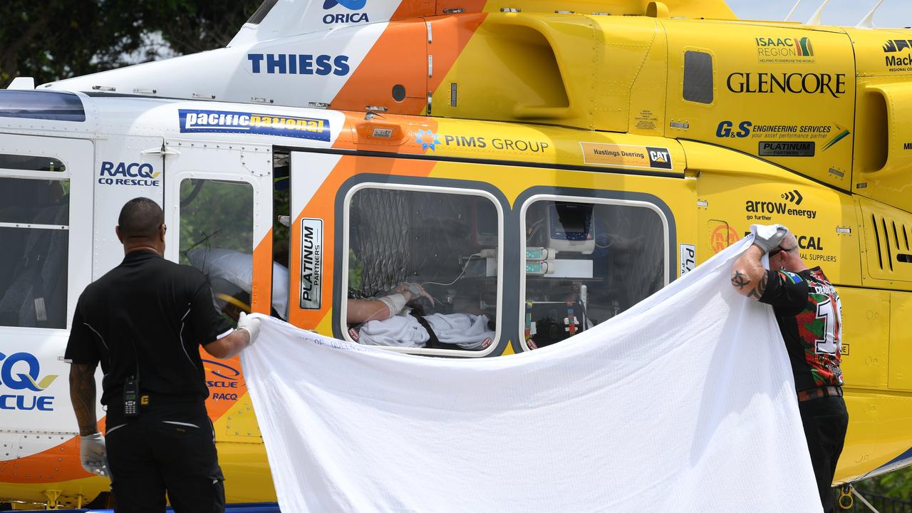 Two young men arrive at Mackay Base Hospital after Whitsundays shark attack.