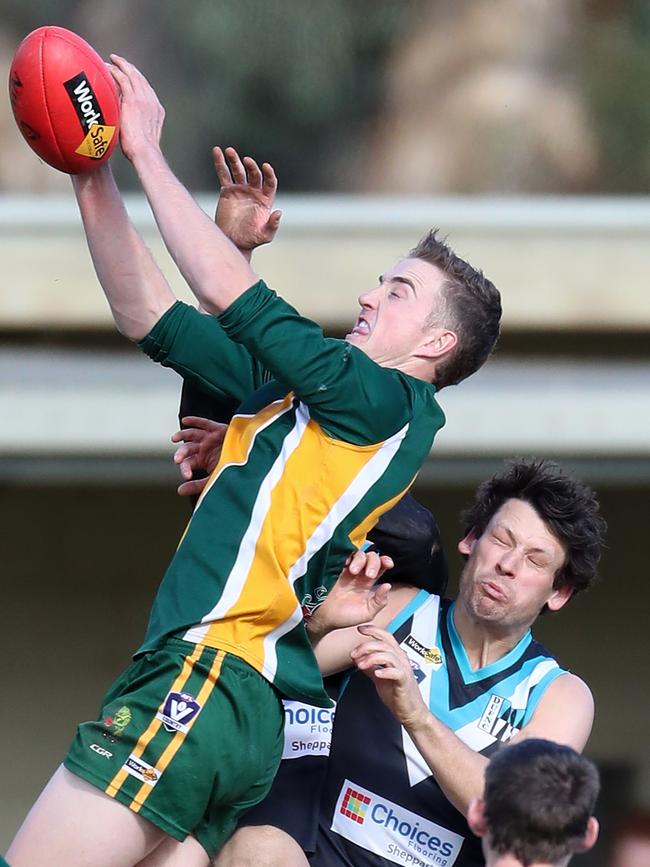 Murchison-Toolamba’s Andrew Lloyd soars for a mark.