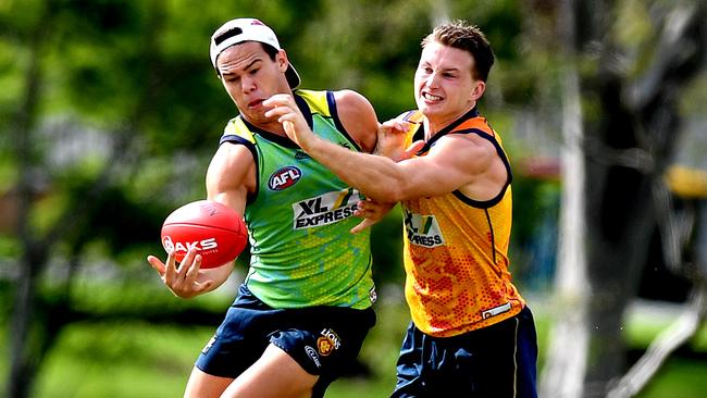 Alex Witherden, right, battles competes for the ball with teammate Cam Rayner. Picture: Bradley Kanaris/Getty Images