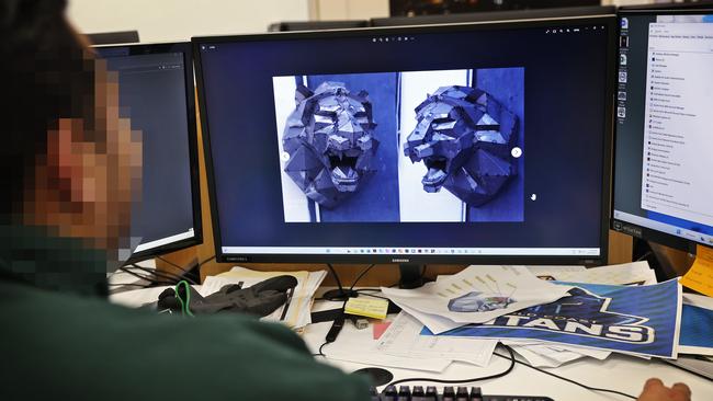 An inmate shows some computer designs for a metal sculpture he is building. Picture: Sam Ruttyn