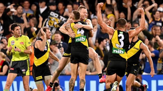 The Tigers celebrate a final quarter goal against the Cats. Picture: Bradley Kanaris/AFL Photos