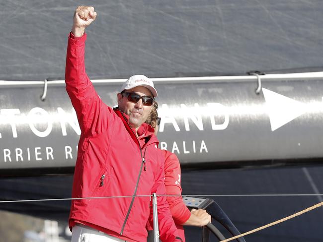 Wild Oats XI skipper Mark Richards celebrates the line honours win. Picture: RICHARD JUPE