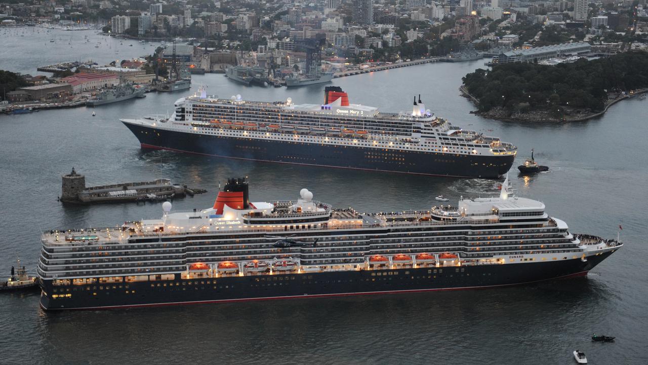 Queen Elizabeth (foreground) follows larger sister ship Queen Mary 2 into Sydney Harbour as Mary makes her way to dock at Garden Island while Elizabeth is on her way to Overseas Passenger Terminal at Circular Quay in 2011.