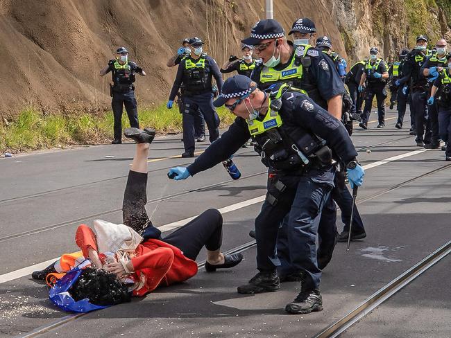 A protester is pepper sprayed by police. Picture: Jason Edwards