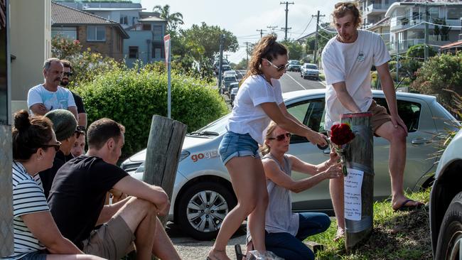 Friends of 26-year-old Liam Anderson, son of Angry Anderson, are pictured assembled at the site of Liam's death. Liam died in Queenscliff on Sunday morning. Picture: Monique Harmer