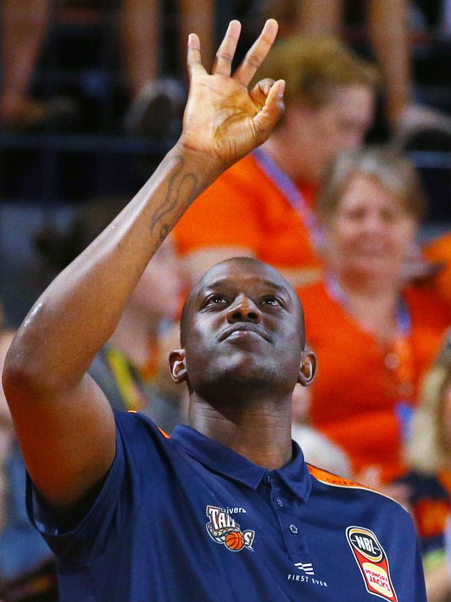 An injured Kouat Noi signals three points in the National Basketball League (NBL) New Year's Eve match between the Cairns Taipans and the South East Melbourne Phoenix, held at the Cairns Convention Centre. PICTURE: BRENDAN RADKE