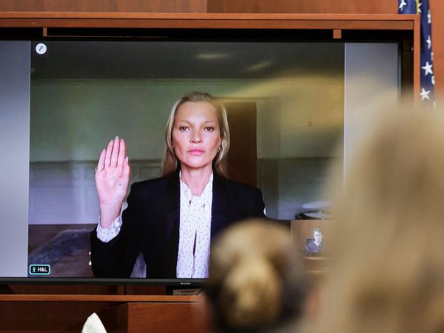 Model Kate Moss is sworn in via video link at the Fairfax County Circuit Courthouse in Fairfax, Virginia, on May 25, 2022. Picture: Evelyn Hockstein / AFP.