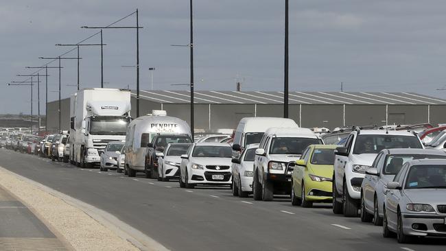 A line of cars and trucks waiting to leave on Sunday. Picture: Sarah Reed