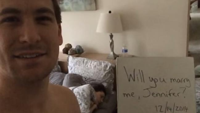 That’s Jennifer asleep in the background as he proposes.