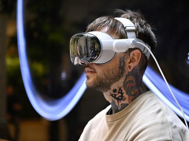 PARIS, FRANCE - JULY 12: A customer tries the device for the first time at the Apple Champs-Ãâ°lysÃÂ©es store during the launch of the Apple Vision Pro on July 12, 2024 in Paris, France. The Vision Pro will also be available in store and online in Australia, Canada, Germany and the United Kingdom. (Photo by Kristy Sparow/Getty Images for Apple)