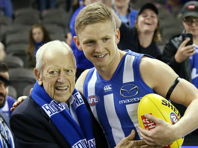 AFL Round 8. North Melbourne vs. Sydney Swans at Etihad Stadium. North Melbourne's skipper Jack Ziebell greets former North Melbourne president Dr Allen Aylett at the top of the race as the players run out for the start of todays game     . Pic: Michael Klein