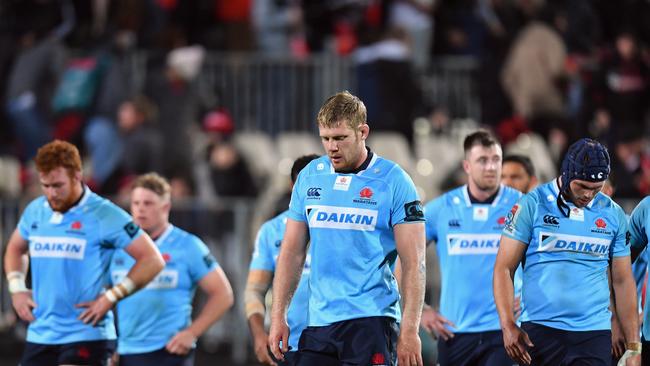 Tom Staniforth (C) and his Waratahs teammates react after the loss.