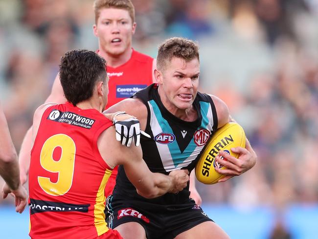 ADELAIDE, AUSTRALIA - JUNE 26: Dan Houston of the Power and Ben Ainsworth of the Suns during the 2022 AFL Round 15 match between the Port Adelaide Power and the Gold Coast Suns at the Adelaide Oval on June 26, 2022 in Adelaide, Australia. (Photo by Sarah Reed/AFL Photos via Getty Images)