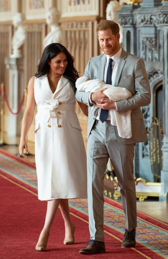 Wearing a sleeveless tailored dress, Meghan Markle showed off baby Archie with husband Prince Harry at St George's Hall. Picture: Getty Images