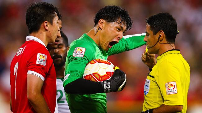 China goalkeeper Wang Dalei rages at the referee after Saudi Arabia were awarded a penalty.