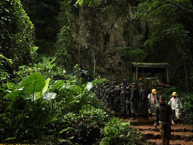 Thai soldiers get into the Tham Luang cave at the Khun Nam Nang Non Forest Park in Chiang rai on June 26. Picture: AFP