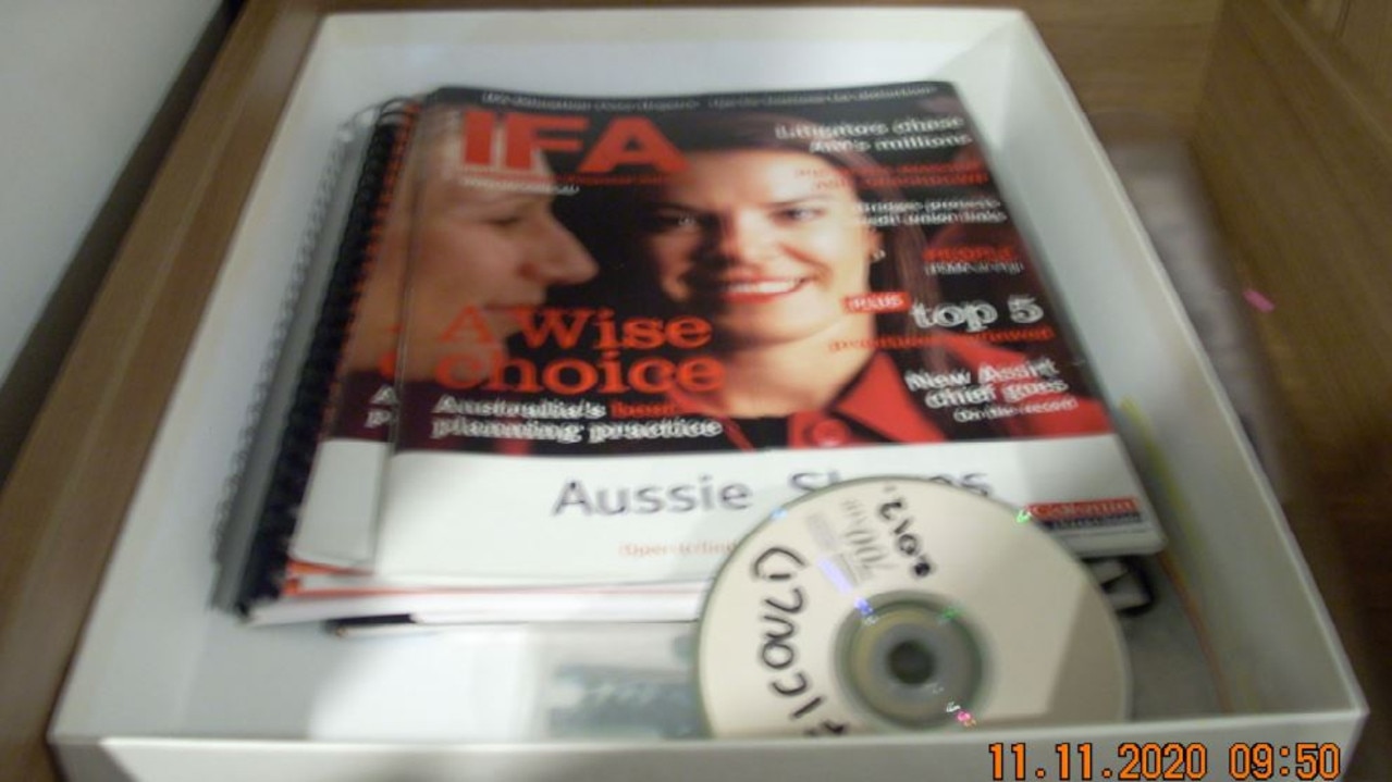 Copies of a financial magazine featuring Melissa Caddick as the cover story.